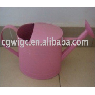 garden pink metal watering can